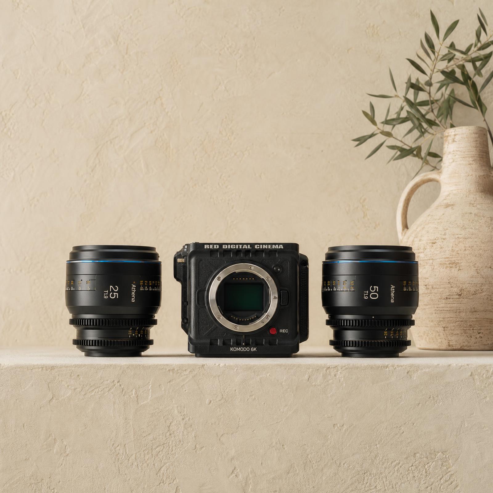 Cinema camera and architectural photography prints on a plaster ledge
